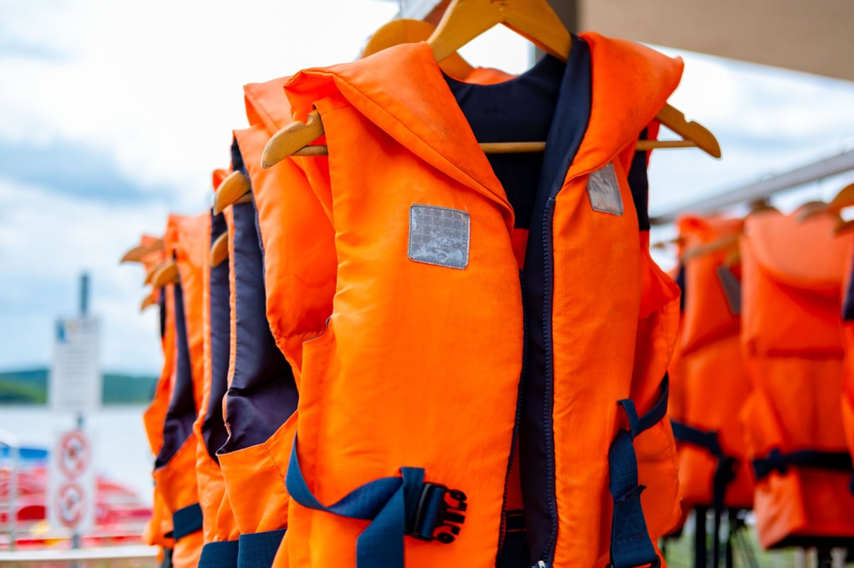 Vibrant orange life jackets ready for water adventure in Aruba